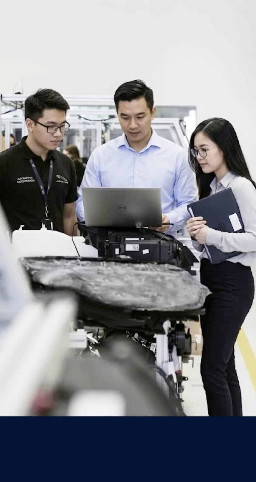 Team test-running equipment in the workshop